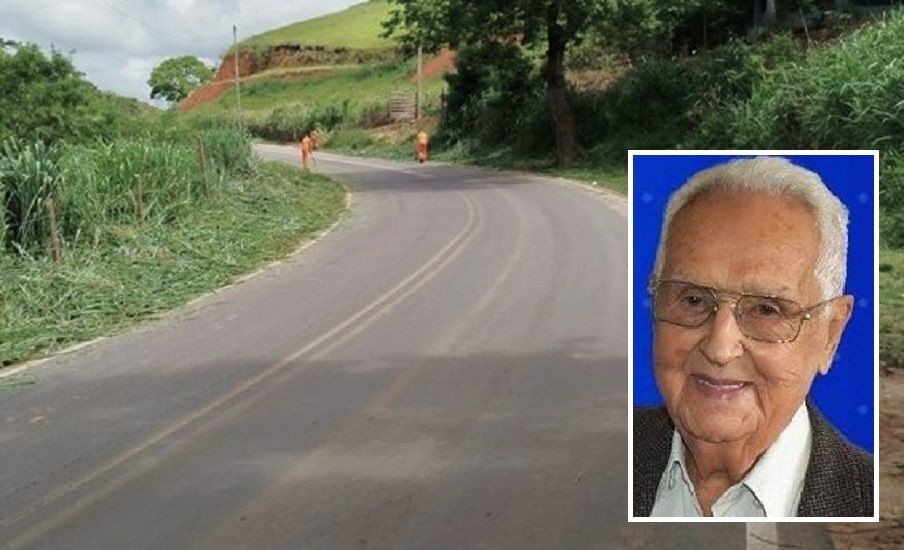 Trecho da rodovia ES-185 em área rural do Caparaó capixaba, com pista asfaltada em curva, vegetação verde ao redor e destaque de retrato do ex-prefeito Nahim Alcure.