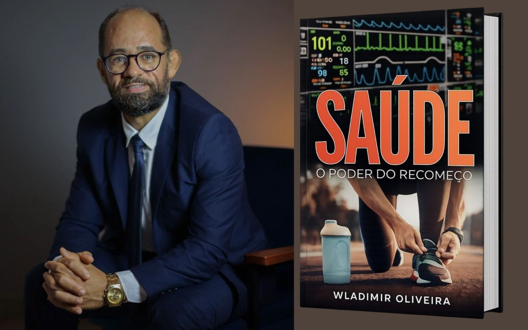 Wladimir Oliveira sentado usando terno azul ao lado da imagem da capa do livro “Saúde: O Poder do Recomeço”.